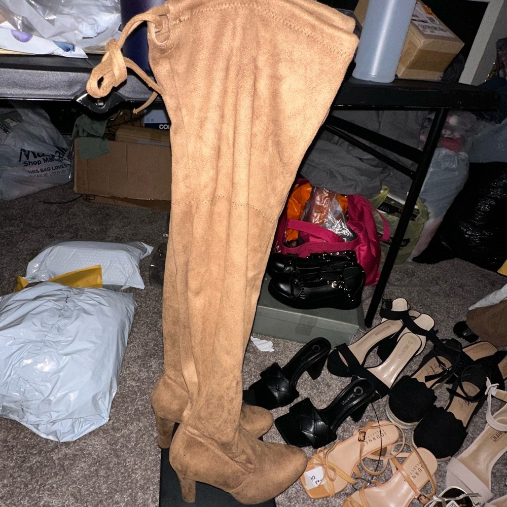 Women’s brown thigh high heeled boots
